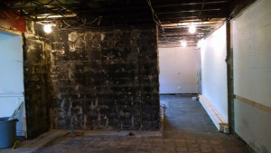 The black wall is where the coat rack used to be.